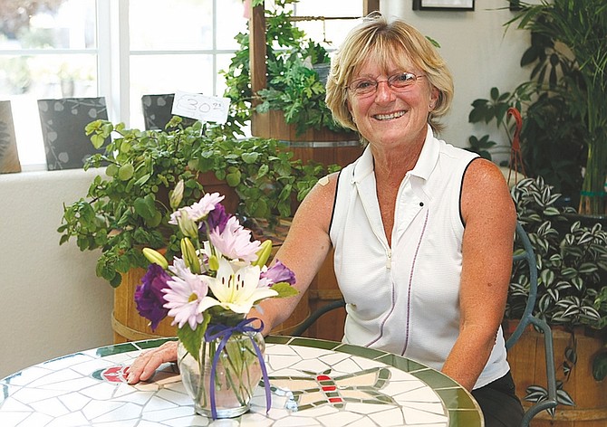 Shannon Litz/Nevada AppealCheryl Cummings, owner of Dayton Valley Floral &amp; Nursery, inside the shop on Tuesday.