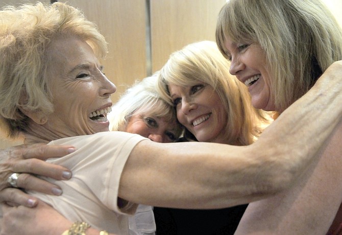 It was all hugs for Nevada first lady Dawn Gibbons, second from right, and her friends, from left, Jill Kopicko, Debbie Cannon and Kaye Lane, in the elevator of the Mills Lane Justice Center following the finalization of her divorce Wednesday July 21, 2010 from Gov. Jim Gibbons. (AP Photo/Reno Gazette Marilyn Newton)