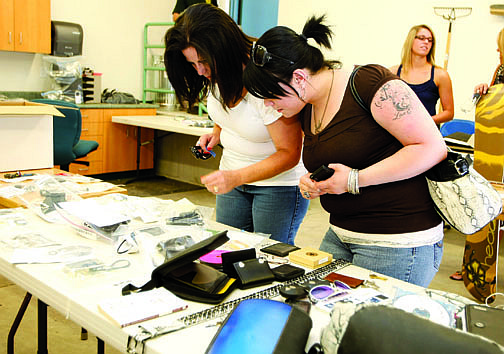 Photos by Shannon Litz/Nevada AppealLaura Shulman and her daughter, Sarah, of Reno, look through items at the Carson City Sheriff&#039;s Office on Friday.