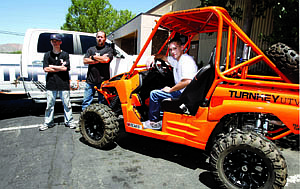 Shannon Litz/Nevada AppealChris Pyle, fabricator/builder Jeremy Westrum and owner Adam Rokoskie with a Kawasaki Teryx 2010 at his shop, Turnkey UTV.