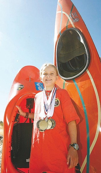 Shannon Litz/Nevada AppealSage Donnelly with her freestyle kayak, for tricks, and her race boat, for speed, on Tuesday.