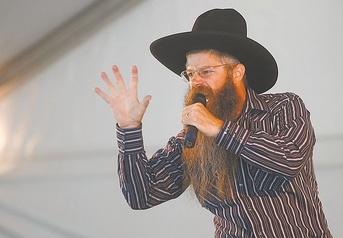 Cowboy poet Tony Argento performs on the main stage in Mormon Station State Historic Park in Genoa during a previous Genoa Cowboy Poetry &amp; Music Festival.