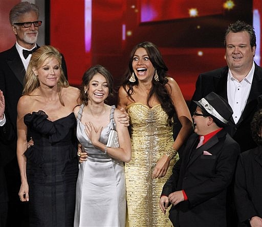 The cast of &quot;Modern Family&quot; react as they accepts the award for outstanding comedy series during the 62nd Primetime Emmy Awards Sunday, Aug. 29, 2010, in Los Angeles. From left are presenter Ted Danson, Julie Bowen, Sarah Hyland, Sofia Vergara, Rico Rodriguez and Eric Stonestreet.  (AP Photo/Chris Carlson)