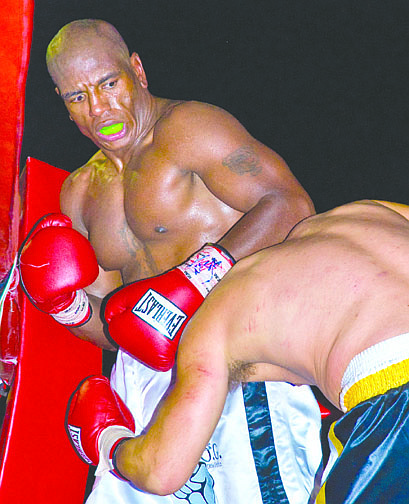 Kim Lamb/Nevada Appeal News ServiceOtis Griffin, black trunks, punches against Billy Bailey