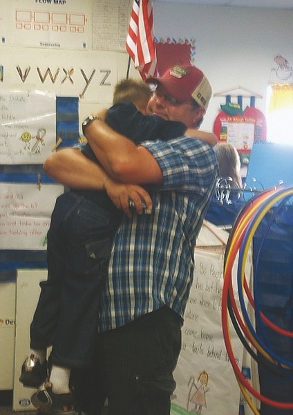 F.T. Norton/Nevada Appeal Zackery Kight gets a bear hug from his dad Daren Kight before kindergarten begins at Bordewich Bray on Monday. See more photos at nevadaappeal.com/photos