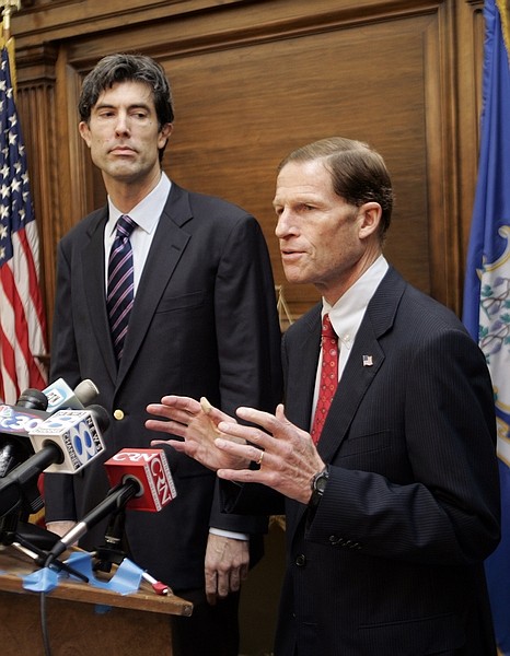 FILE - In this Nov. 6, 2008 file photo, Jim Buckmaster, CEO of Craigslist, left, watches as Connecticut Attorney General Richard Blumenthal speaks at a news conference in Blumenthal&#039;s office in Hartford, Conn. Craigslist has apparently closed the adult services section of its website, two weeks after 17 state attorneys general demanded it shut down the section. (AP Photo/Bob Child, File)