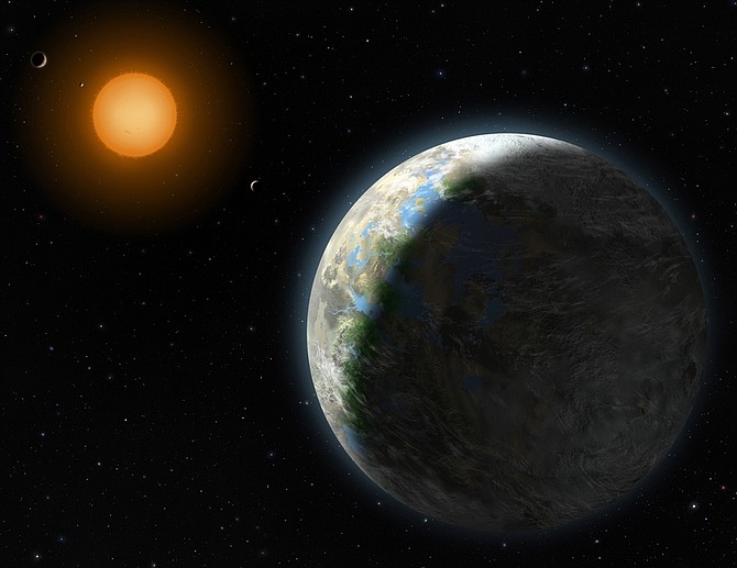 This undated handout artist rendering provided by Lynette Cook, National Science Foundation, shows a new planet, right. Astronomers have found a planet that is in the Goldilocks zone _ just right for life. Not too hot, not too cold. Not too far from its sun, not too close. And it is near Earth _ relatively speaking, at 120 trillion miles. It also makes scientists think that these examples of habitable planets are far more common than they thought. (AP Photo/Zina Deretsky, National Science Foundation)