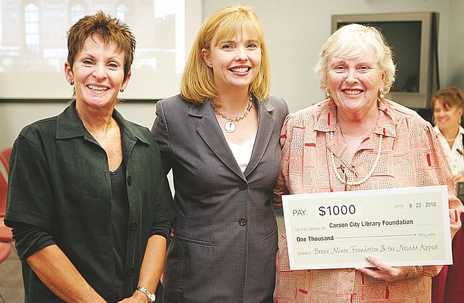 Shannon Litz/Nevada AppealPam Graber, left, and Pat Glick, right, accept $1,000 on behalf of the Carson City Library Foundation, from Nevada Appeal Publisher Niki Gladys. The award is part of the Nevada Appeal&#039;s Literacy for Life campaign.