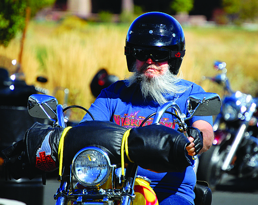 Photos by Brian Duggan/Nevada Appeal Fred Swain, 64, rides his 1964 Harley-Davidson on Thursday at Carson City Harley-Davidson for a five-day celebration.
