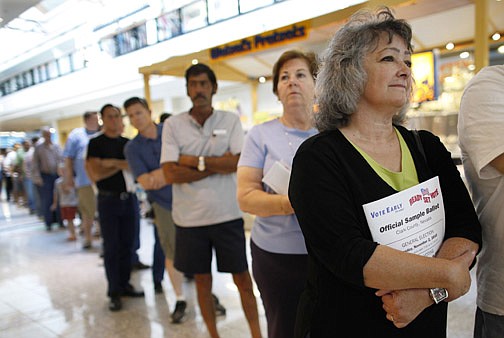 Maria Delgado, right, stands in line waiting to vote on the first day of early voting Saturday, Oct. 16, 2010, in Las Vegas. Early voting began Saturday in Nevada and goes through Oct. 29.  (AP Photo/Julie Jacobson)