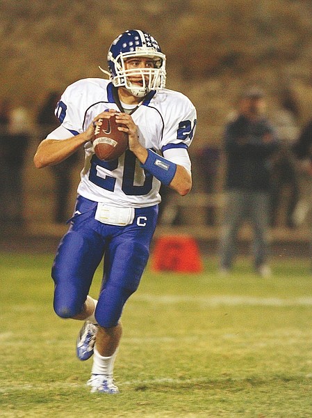 Jim Grant/Nevada AppealSenator quarterback Trey Jensen rolls out of the pocket to complete a pass against the Spanish Springs on Friday night. Carson won 23-13.
