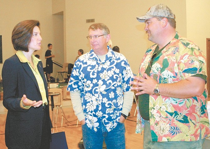 Sandi Hoover/Nevada AppealAttorney General Catherine Cortez Masto, left, talks with Boy Scouts Pinenut District Commissioner Bryan Stockton, middle, and Advancement Recognition Chairman for the Pinenut District Rob Boehmer during the annual Merit Badge Fair Saturday at the Church of Jesus Christ of Latter-day Saints. As part of her &quot;Peace Begins at Home&quot; Domestic Violence Awareness Program, Masto made a presentation on how to handle situations of domestic violence if they observe signs that abuse may be occurring. Masto also was to select a statewide patch design and symbol from Nevada Area Council Boy Scouts submissions. Oct. 9 marks the initial launch of the patch. The A.G.&#039;s office will use the scouts to increase awareness and prevention among teens. The requirements for completion of the patch closely follow the Boy Scouts Merit Badge Advancement Program.