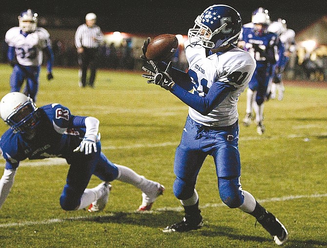 Photos by Shannon Litz/Nevada AppealChris Steele, 81, hauls in a pass during Thursday&#039;s game against Reno. Carson lost 21-17 despite having a 17-0 lead heading into the fourth quarter.
