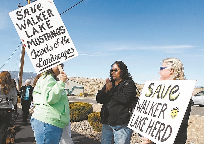 Shannon Litz/Nevada AppealBrandi McNally talks to Debbie Collins and Cathy Norcom, all of Hawthorne, on Friday in front of the Carson City Bureau of Land Management office.