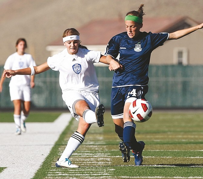 Shannon Litz/Nevada Appeal Carson&#039;s Kenzie Tillitt (2) and Damonte&#039;s Ciara O&#039;Driscoll (14) fight for the ball in Carson&#039;s 2-1 win on Saturday. Carson and regional winner Douglas will face each other on Friday in the state semifinals.