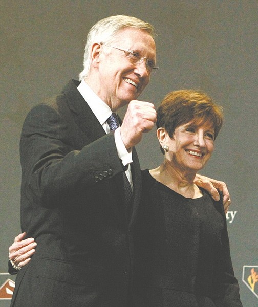 Sen. Harry Reid, D-Nev., and his wife Landra take the stage at the Nevada State Democratic election night party after Reid defeated Sharron Angle to win re-election, Tuesday, Nov. 2, 2010, in Las Vegas.  (AP Photo/Jae C. Hong)