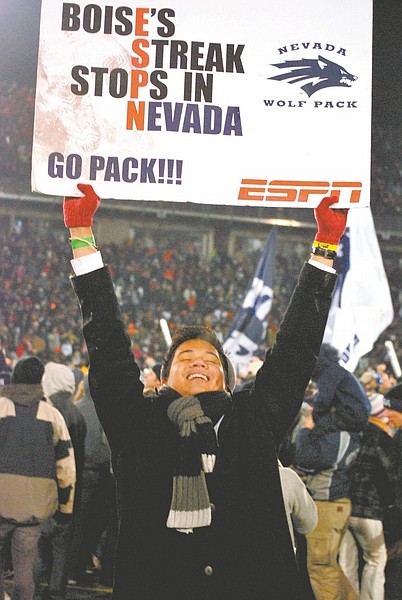 Steve Ranson/Nevada Appeal News ServiceA Nevada fan celebrates the No. 19 Wolf Pack&#039;s 34-31 victory over No.4 Boise State on Friday night at Mackay Stadium.