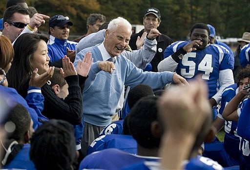 In this photo taken Oct. 30, 2010, Lakewood High School football coach Warren Wolf, center, celebrates his first win after the Piners beat Central Regional 20-15, breaking the their 33-game losing streak, in Lakewood, N.J. (AP Photo/The Asbury Park Press, Doug Hood)