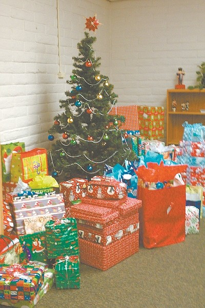 CourtesyGifts for students in need at area schools pile high at the office of Nevada State Division of Health Care Financing and Policy. Employees in the office donate to numerous causes during the holiday season.