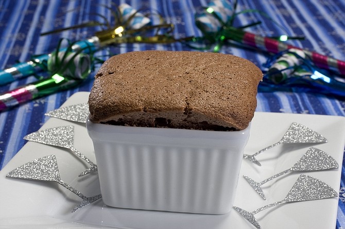 This Nov. 28, 2010 photo shows a chocolate bourbon butterscotch souffle in Concord, N.H. These souffles are designed to be easy to make, sturdy enough to serve without stress and will make you look like a kitchen wizard. (AP Photo/Larry Crowe)