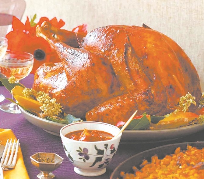 Caption: A spicy, flavorful Mexican fruit mole sauce adds a bit of zip to the same-old, same-old holiday dinner, without upsetting the traditionalists -- at least not too much. Credit: Photograph by Frances Janisch for &quot;Daisy&#039;s Holiday Cooking&quot; by Daisy Martinez with Chris Styler (Atria Books, 2010)