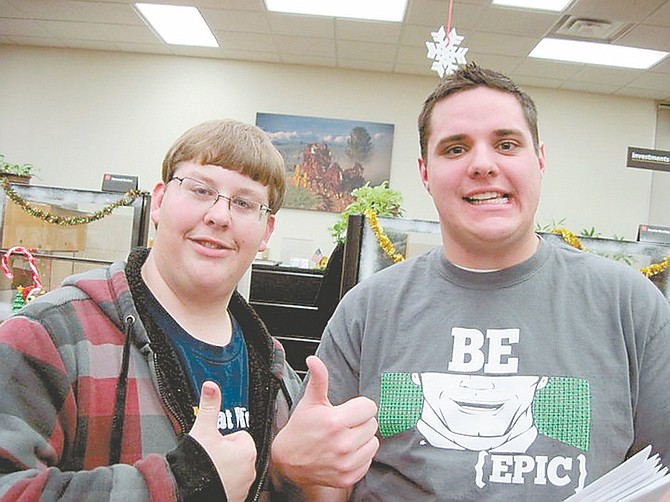 Courtesy the Mentor CenterPaul Young, right, and mentee Jake give a big thumbs up to the mentor program.