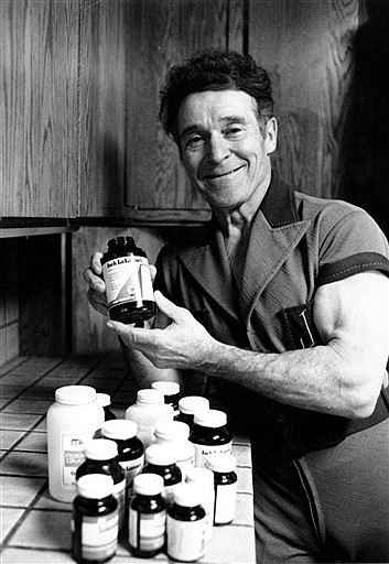 FILE - In this Feb. 20, 1980 file photo, fitness guru Jack LaLanne shows off his brand of Vitamins at his home in Hollywood, Calif.  LaLanne, the fitness guru who inspired television viewers to trim down and pump iron for decades before exercise became a national obsession, has died. He was 96. (AP Photo, File)