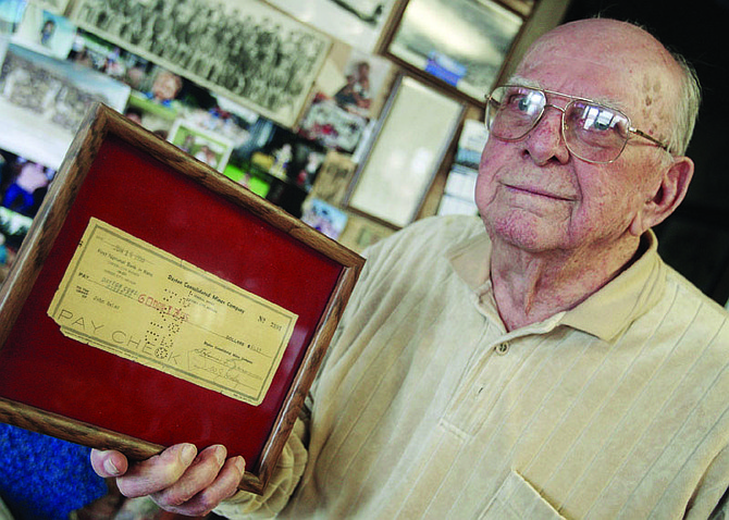 Jim Grant/Nevada AppealCarson City resident John Zalac, 93, who worked as a gold miner in Virginia City and Gold Hill during the 1930s, displays his two-week paycheck, dated June 16, 1938, for the amount of $60.13 from the Dayton Consolidated Mines Co.
