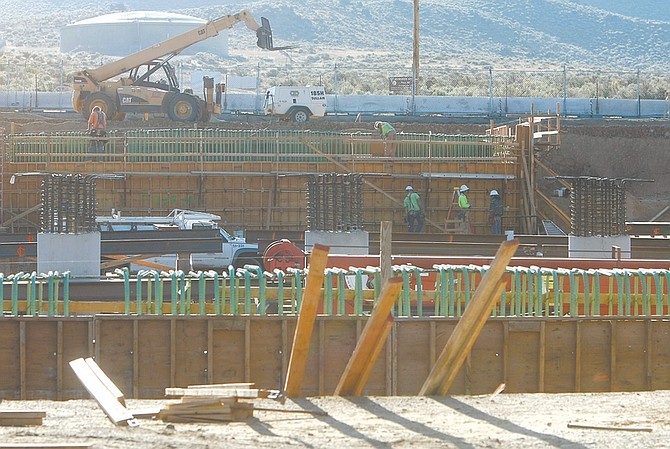 Published Caption: LEFT: Freeway bypass bridge construction at Koontz Drive on Wednesday morning.