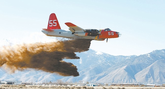 Shannon Litz/Nevada AppealA P2 drops retardant at the Minden-Tahoe Airport during a test run.