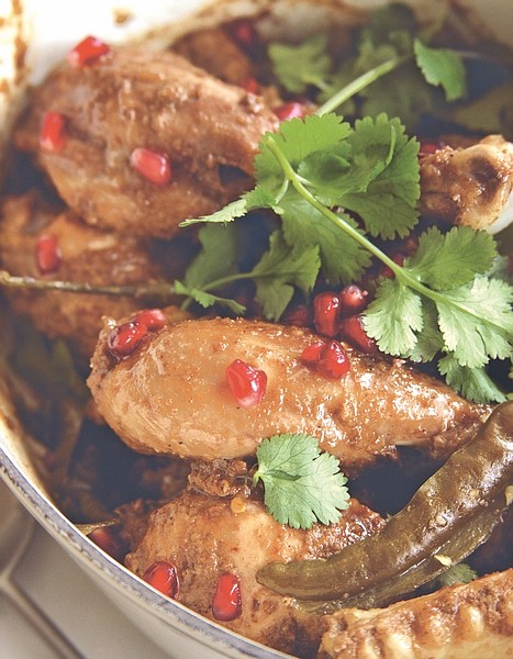 Jewel-like pomegranate seeds make this Indian dish of chicken shine in taste and presentation. Credit: Photo by Vanessa Courtier for &quot;Anjum&#039;s New Indian&quot; by Anjum Anand (Wiley, 2010)