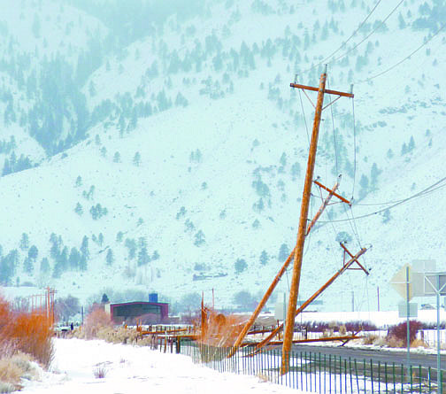 Kurt Hildebrand/Nevada AppealPower poles leaning over on Muller Lane on Friday morning.