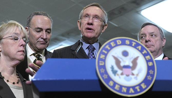 Senate Majority Leader Harry Reid of Nev., second from right, responds to a statement made by House Speaker John Boehner of Ohio., on Capitol Hill in Washington, Thursday, Feb. 17, 2011. He is joined, from left, Sen. Patty Murray, D-Wash., Sen. Charles Schumer, D-N.Y., and Senate Majority Whip Richard Durbin of Ill. (AP Photo/Susan Walsh)