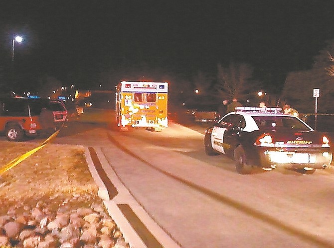 F.T. Norton/Nevada AppealRescue vehicles line the Seely Loop side of Mills Park where deputies found a man with a gunshot wound to the leg Monday night.