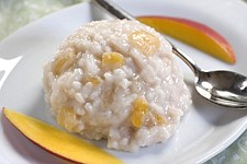 This Oct. 5, 2010 photo shows basmati-almond rice pudding with mango. The rich flavor of almond milk makes this rice pudding a wonderful non-dairy side.   (AP Photo/Larry Crowe)