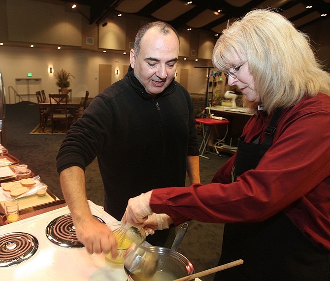 Jim GrantChef Eric Villegas and Bonnie Betts of Dream Dinners prepare a lemon angel cake roll on the stage kitchen Saturday morning at the Nevada Appeal&#039;s Home &amp; Lifestyle Expo 2011 with Taste of Home Cooking School. Vendor booths are now open and the cooking school doors open at 2 p.m. with the show starting at 3 p.m. at the Capital Christian Event Center, 1600 Snyder Ave.