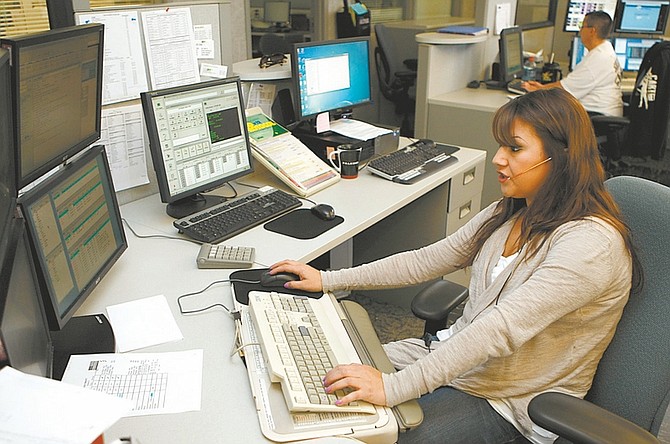 Shannon Litz / Nevada Appeal Public safety communications operator and trainer Maricela Ceballos works at the Carson City Dispatch Center on Wednesday.