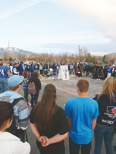 Jim Grant/Nevada AppealCarson High School students gather for a candle light vigil for classmates Stephen Anderson and Keegan Aiazzi before class on Monday morning.