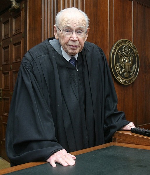 FILE - In this June 4, 2007 file photo, U.S. Federal District Judge Wesley Brown poses in Wichita, Kan. Brown is the oldest working federal judge in the nation, one of four appointees by President Kennedy still on the bench. Federal judgeships are lifetime appointments, and no one has taken that term more seriously than Brown.(AP Photo/The Hutchinson News, Travis Morisse, File)