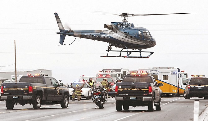 Shannon Litz /Nevada AppealCare Flight takes off from the scene of a fatal accident in Mound House on Friday afternoon.