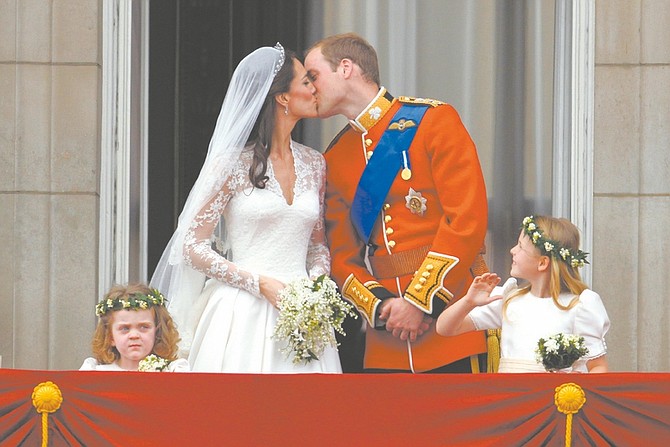 Britain&#039;s Prince William kisses his wife Kate, Duchess of Cambridge on the balcony of Buckingham Palace after the Royal Wedding in London Friday, April, 29, 2011. (AP Photo/Matt Dunham)