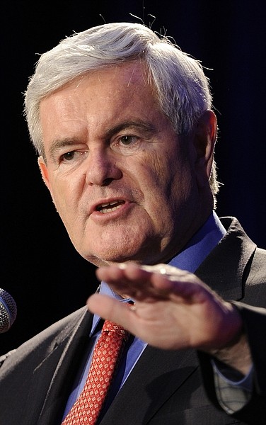 IN this May 13, 2011, photo, Newt Gingrich speaks to the Georgia Republican Party in Macon, Ga. An official presidential candidate for less than a week, Gingrich already finds himself in hot water with conservatives for suggesting he supports health care mandates while at the same time deriding a Republican budget proposal that would replace Medicare with vouchers. (AP Photo/John Amis)