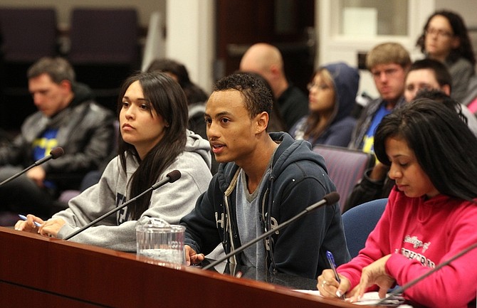 Nevada college students, from left, Beatriz Aguirre, Nathaniel Phillips and LeLiana DeLeon testify against deep cuts to higher education during a hearing at the Legislature on Wednesday, May 18, 2011, in Carson City, Nev. (AP Photo/Cathleen Allison)