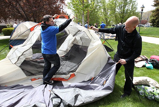 Protesters J.T. Creedon, left, and Tyler Egeland set up a tent Monday, May 16, 2011, at the Legislature in Carson City, Nev. About 60 people are expected to participate in a three-day event organized by advocates who support a Democratic tax package. (AP Photo/Cathleen Allison)