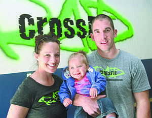 Jim Grant/Nevada AppealMark and Sarah Lobsinger, with their 8-month-old daughter Logan are the owners of CrossFit located at 509 Moses St.
