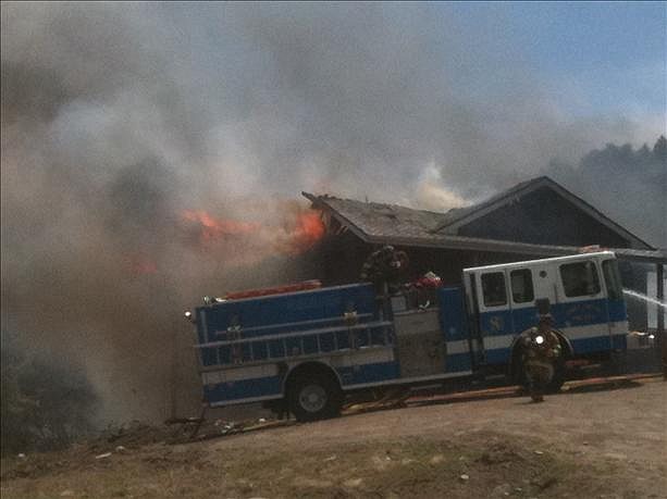 Courtesty KTVN.com A windswept fire destroyed a home and garage in the Virginia City Highlands this afternoon.