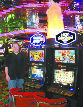 Jim Grant/Nevada AppealCasino Fandango General Manager Court Cardinal stands next to one of the many &quot;Hot New Game Zones&quot; that have been placed around the casino floor.