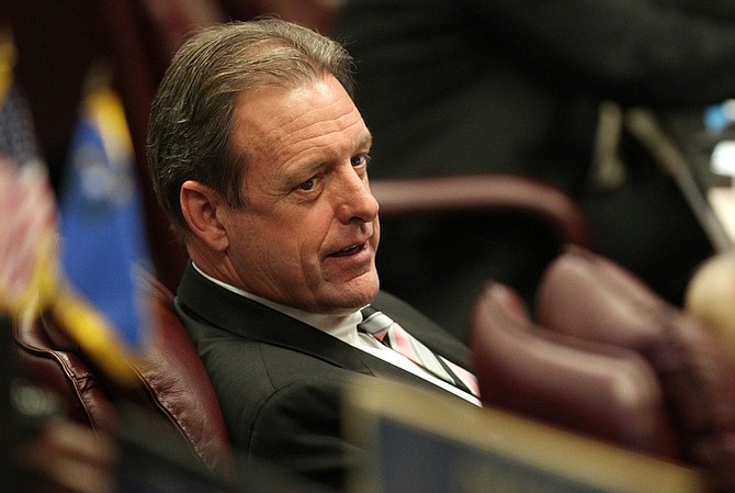 Nevada Sen. John Lee, D-North Las Vegas, works on the Senate floor Monday, May 23, 2011, at the Legislature in Carson City, Nev. Earlier Monday, Lee&#039;s bill to seek changes to the rules governing Tahoe Regional Planning Agency was amended and passed out of committee. (AP Photo/Cathleen Allison)