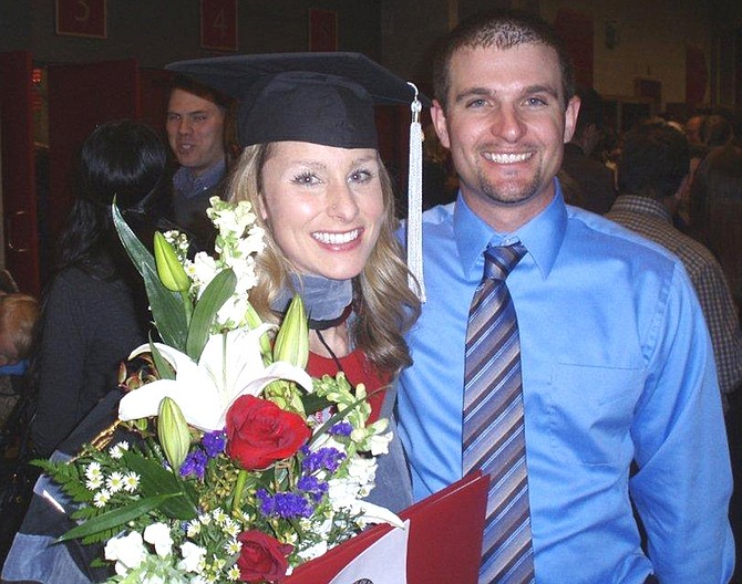 Erika Michelle Johnson, daughter of Dr. Dave and Kathy Landis, seen with her husband Vince after graduating with a Doctor of Veterinary Medicine.