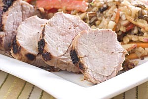 Grilled orange-miso pork tenderloin is seen in this May 23, 2010 photo. This recipe uses a sticky flavoring paste to keep moisture in and impart a great taste. (AP Photo/Larry Crowe)